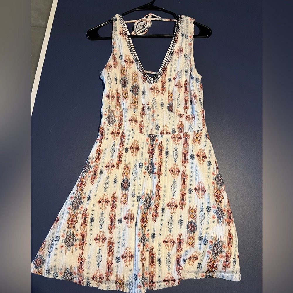White dress with navy/red/orange detailing